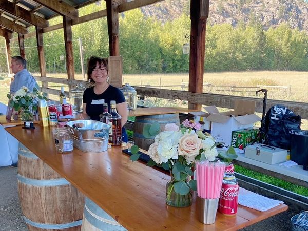 Elite Events BC bartender smiling. Elite Events BC offers bartending services for weddings & events