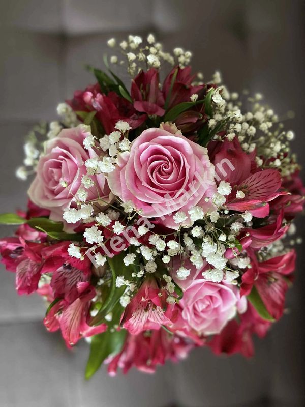 Wedding flower bouquet with pink roses and baby's breath. Centrepieces by Elite  Events in Kamloops