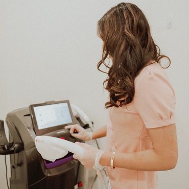 Professional technician holding the DPL Laser hair removal machine in surrey and white rock spa