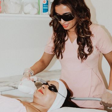 laser technician with laser machine at the laser spa