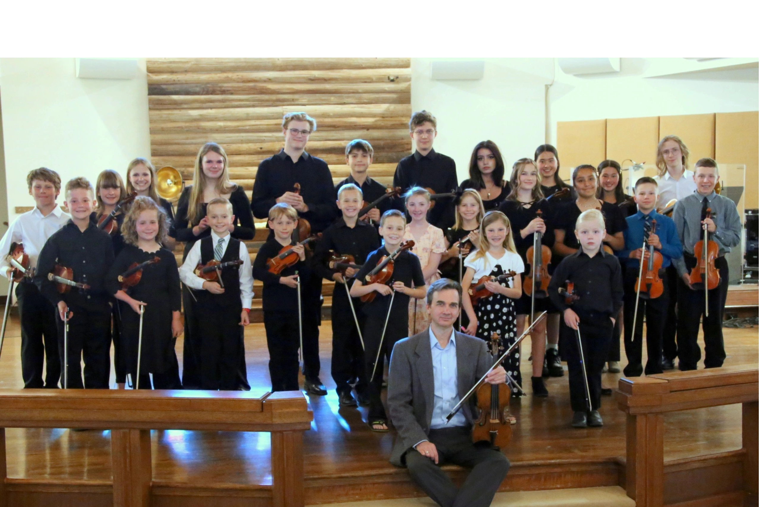 suzuki violin students at a concert