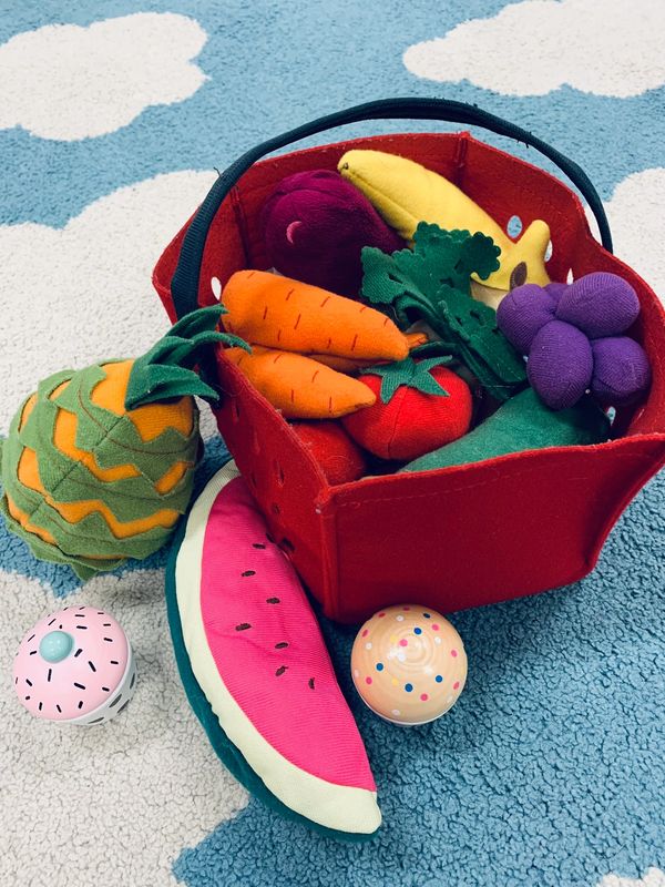 soft toys of fruit and vegetables in basket