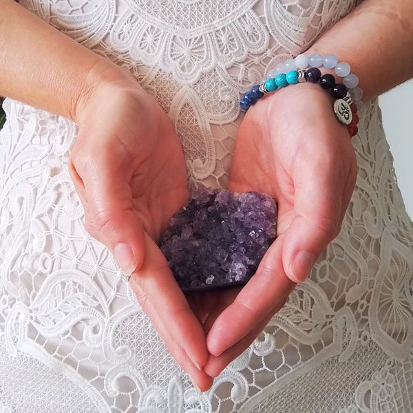 Reiki Adelaide crystal healing in gentle hands, supporting relaxation, stress relief, & energy flow