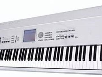 White digital piano keyboard with display and controls.