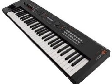 Electric keyboard synthesizer with black and white keys.