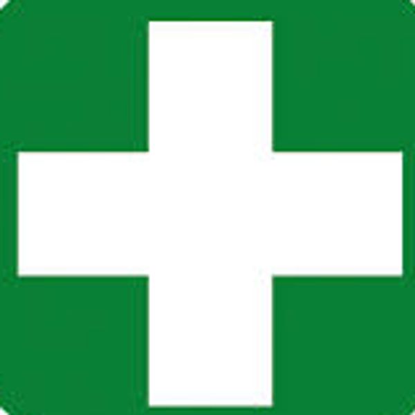 White medical cross on a green background symbolizing healthcare.