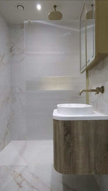 modern stylish bathroom with fluted glass