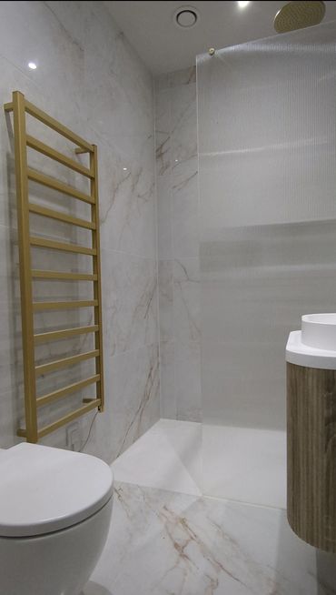 luxury marble bathroom with brushed brass