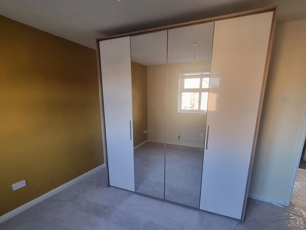 large white 4 door wardrobe with mirrors