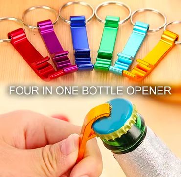 Colorful four-in-one keychain bottle openers on a wooden surface.
