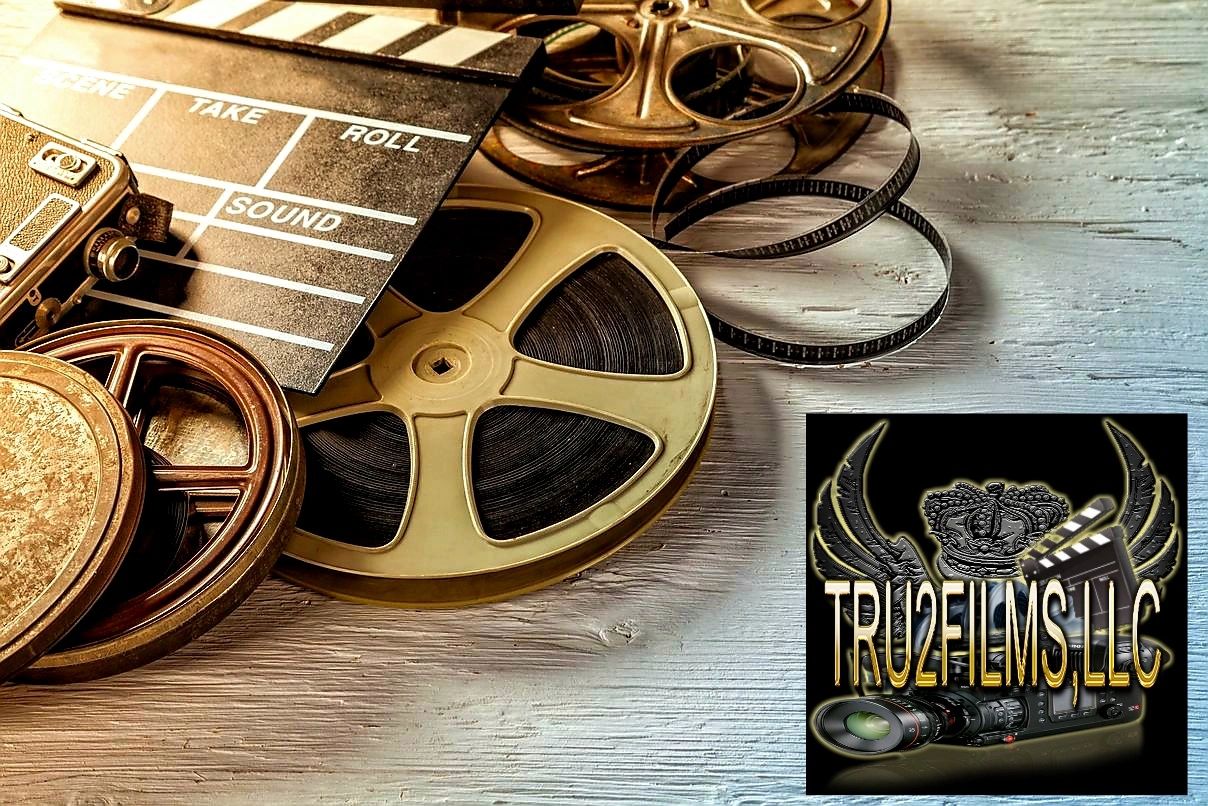 Film reels and clap board with the Tru2films LLC logo