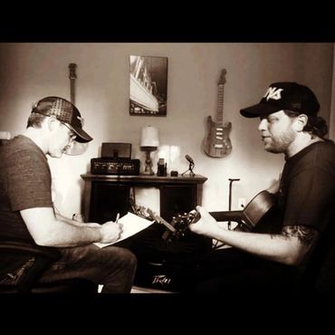 Teaching a guitar lesson.