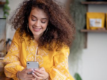 Woman filing her income taxes on phone