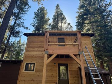 new siding and small hog wire deck.