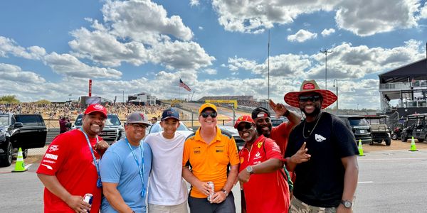 alt="Friends gathered together at the Formula 1 United States GP,enjoying the race weekend at COTA."