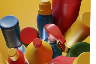 Colorful bottles and containers arranged against a yellow background.
