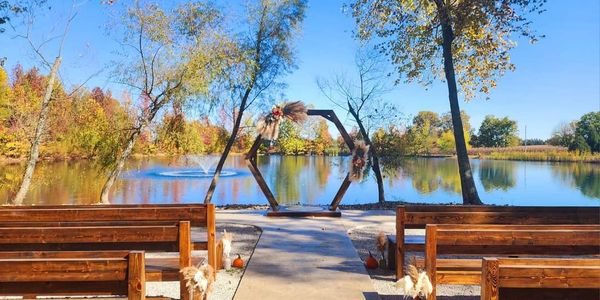 Lakeside Wedding Ceremony, altar, flowers, trees, benches