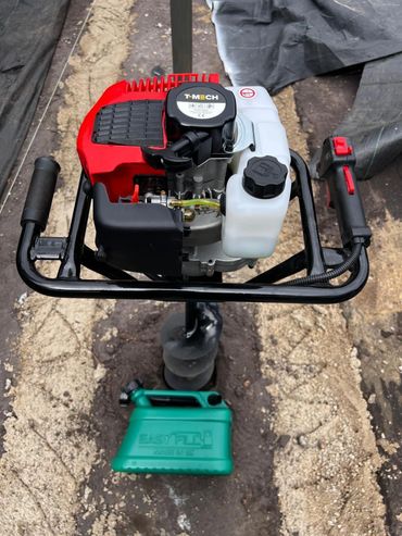 Easyfill fuel can alongside a drill, supporting spill-free refuelling for power equipment