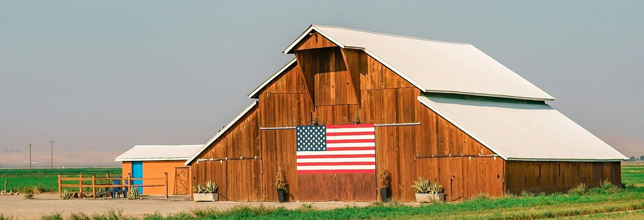 Made in USA Flags Company logo of bard with American Flag