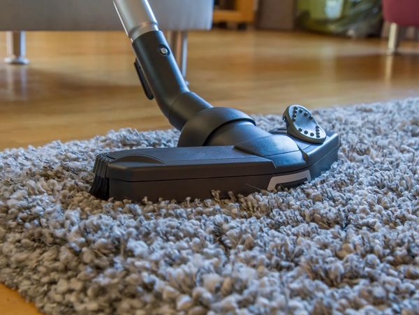 Cleaning the floor with vacuume cleaner
