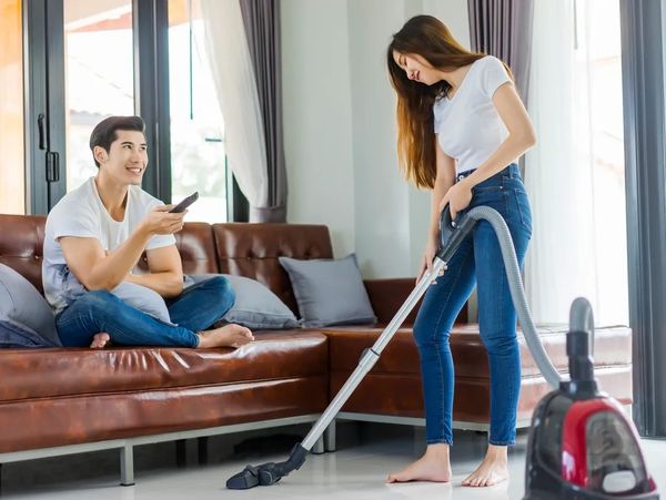Women cleaning with vacuum cleaner