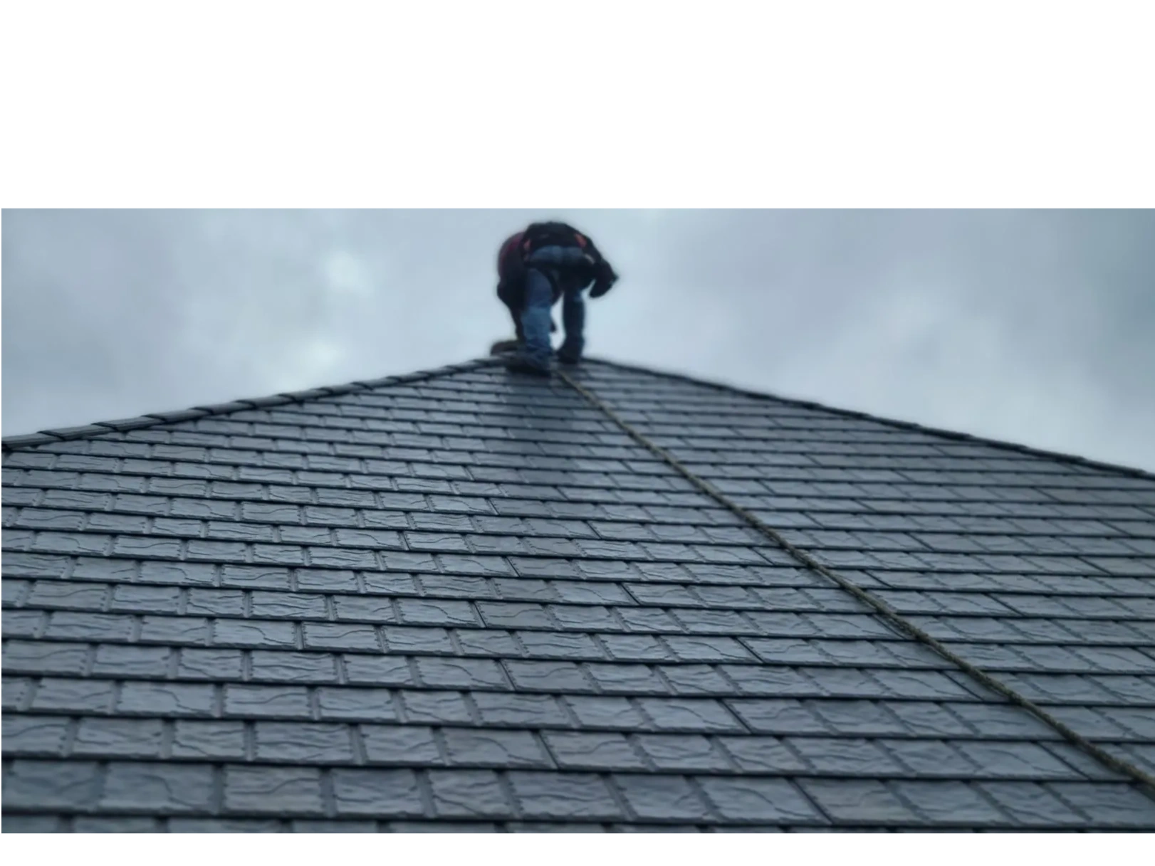 Our skilled craftsman installing a steel slate shingle style metal shingle roof in Mobile, AL
