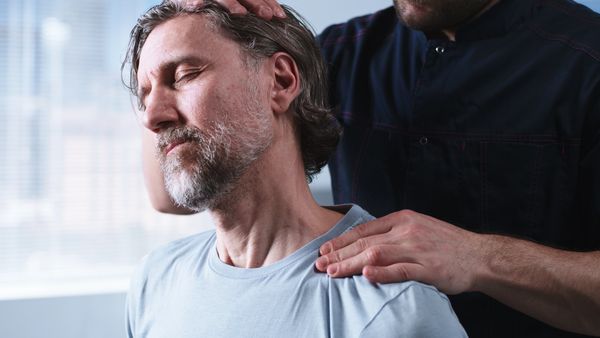 Man receiving a neck and shoulder massage