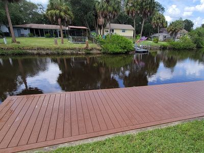 Dock on the water with brown composite deck boards in tampa fl
