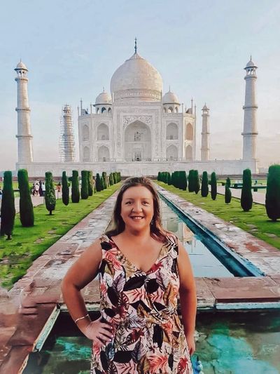 Sinead Phillips, SheVentures founder and Travel Agent, standing in front of the Taj Mahal in India