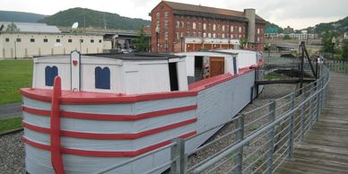 Decommissioned canal barge on display along the trail in Cumberland