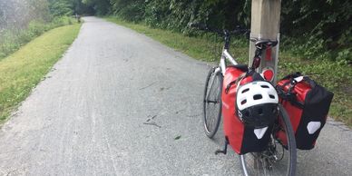 Bicycle leaning against signpost on the Great Allegheny Passage near Rockwood, PA