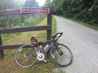 Sign on the Great Allegheny Passage near Confluence indicating the direction to Cumberland, MD