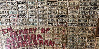 The ceiling of Bill's place is covered in $1 bills