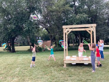 Kids playing bubbles