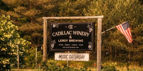 Sign for Cadillac Winery and Leroy Brewing.