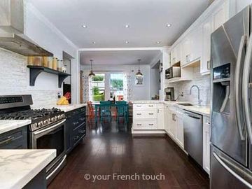 Affordable kitchen and bathroom renovation in Ottawa with cabinets, marble counters and backsplash