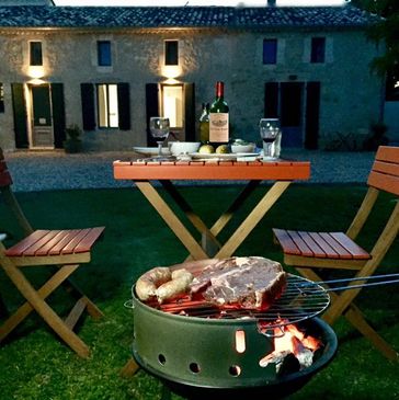 Guests enjoying a BBQ in the garden