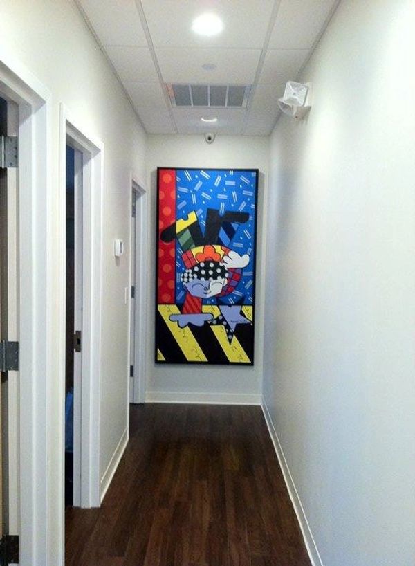 Pediatric dental office with colorful artwork of boy.