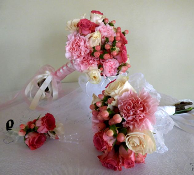 beautiful wedding flowers, bride's bouquet, boutonniere and bride's throw bouquet. 