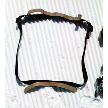 Secured skis viewed from above, ready for transport or pack attachment.