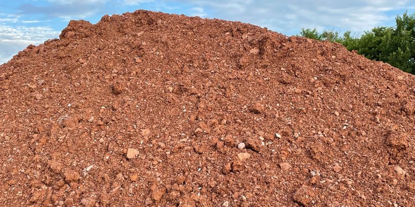 Shredded Red Shale for ball diamonds is quick drying and easy to maintain. Delivery available.