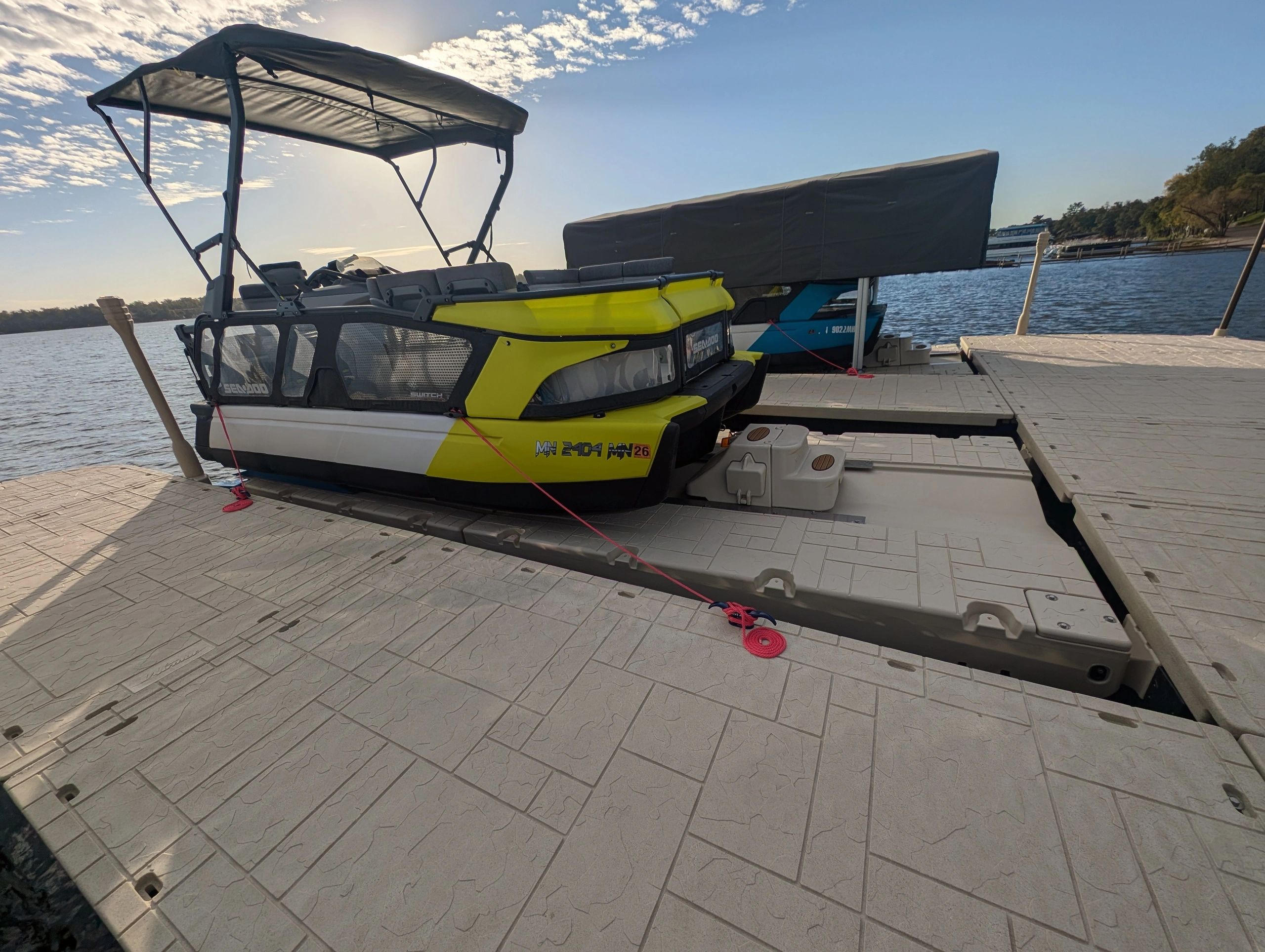 Drive on Dock with sea doo switch boat parked on it.