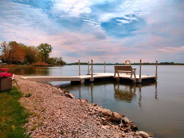 Floating Wave Armor dock installed on Sandusky Bay with Benches by AquaLife Construction.