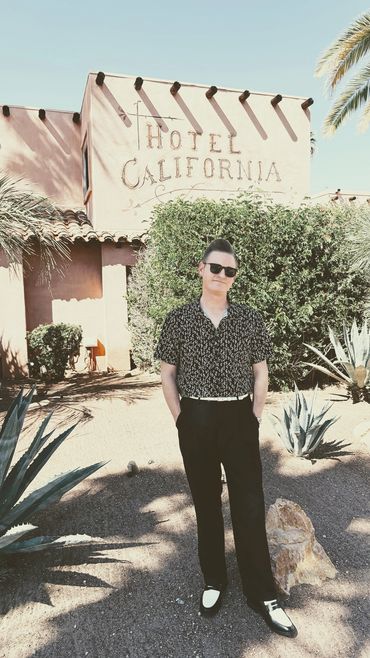 Man standing outside California building.