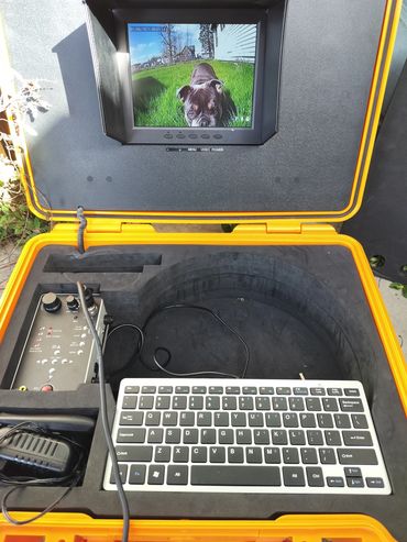 Sewer camera demo for a Septic Tank line with bulldog on screen In Lebanon Oregon 