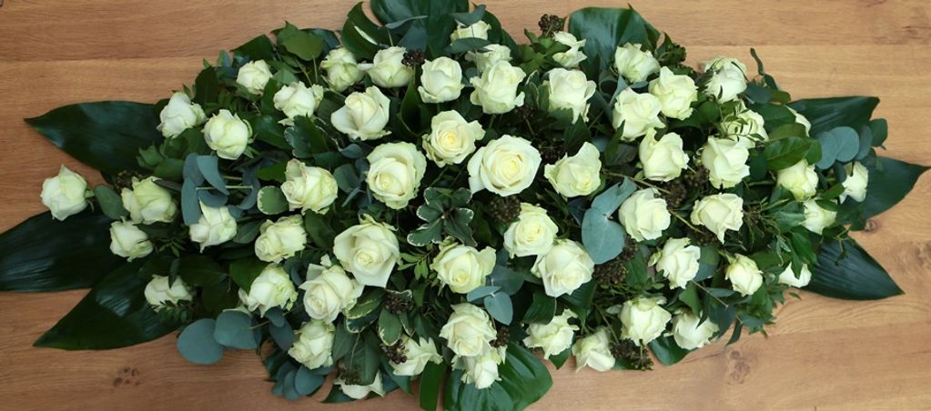 White rose coffin spray. Double ended funeral flower spray. London