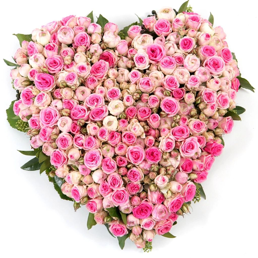Heart funeral flower tribute. Pink rose and spray rose