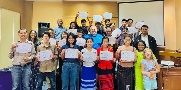Group of people hold the certificate on hand