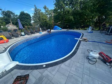 Finishing up a new liner and filling with water from water man.