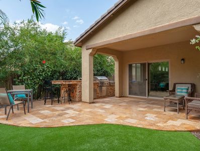 Outdoor patio, outdoor kitchen, travertine, patio pavers, tropical landscape